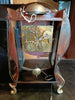 Horloge murale ancienne aux finitions noires et dorées