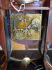 Horloge murale ancienne aux finitions noires et dorées