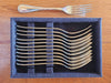 Service de couverts Christofle en métal argenté, composé de 81 pièces.