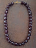 Ancien collier en bakélite rouge cerise