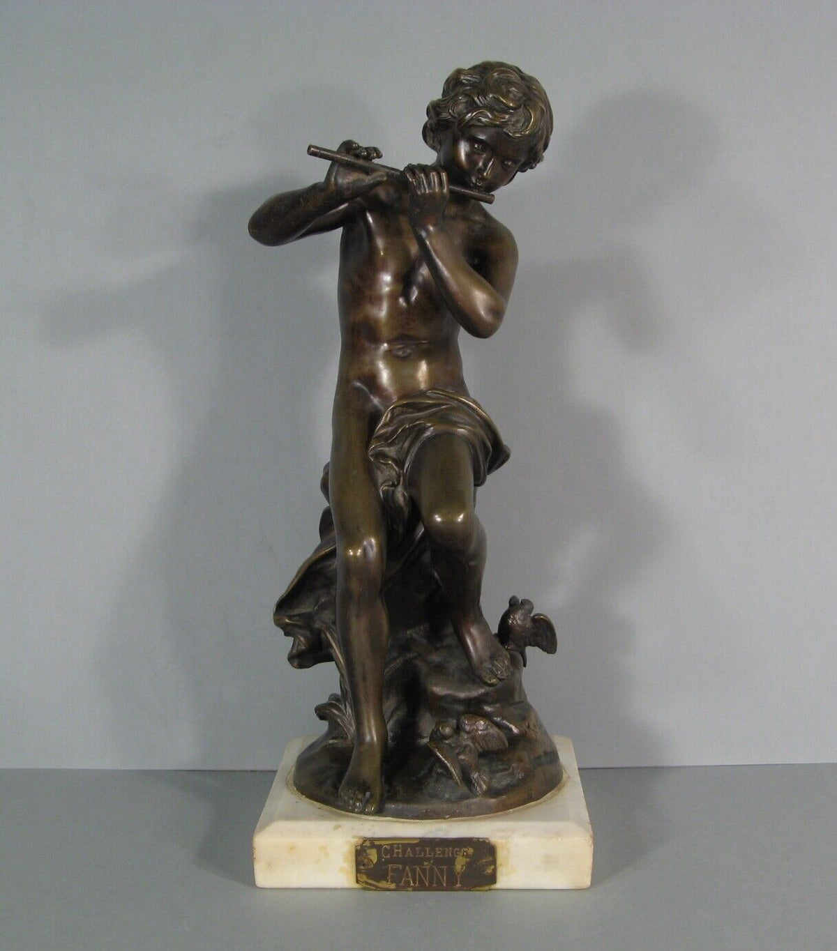 Sculpture en bronze joueur de flute