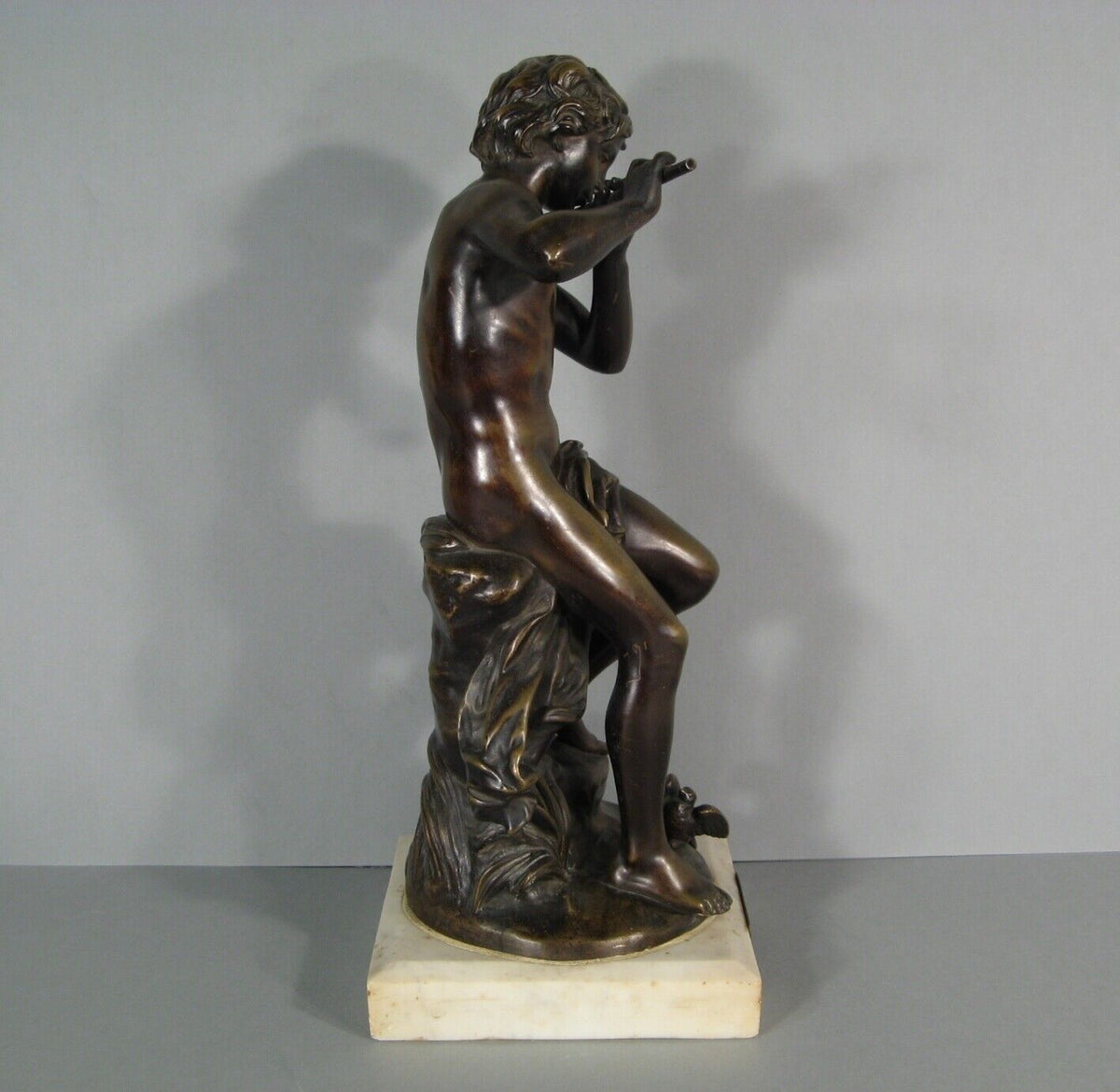 Sculpture en bronze joueur de flute
