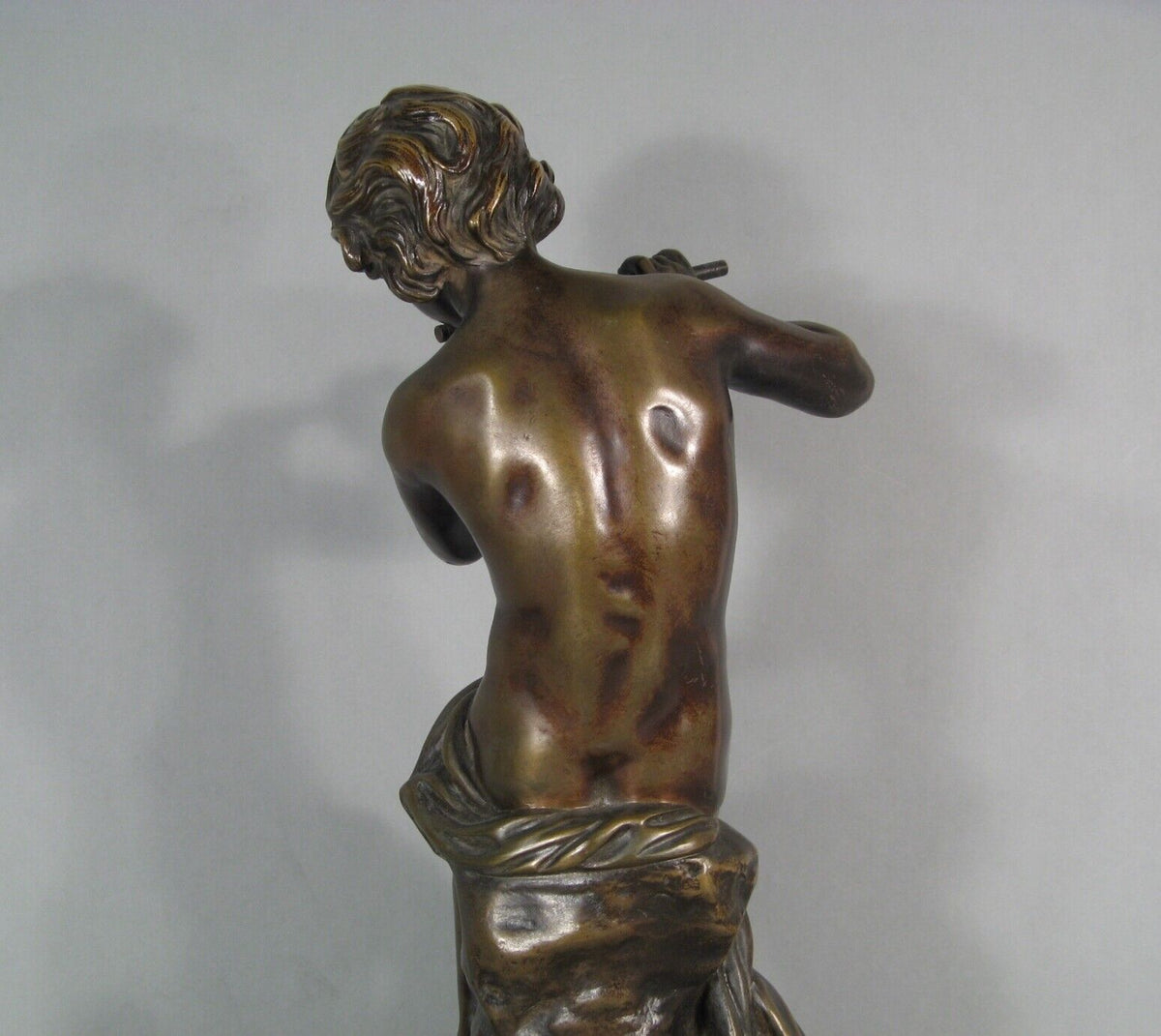 Sculpture en bronze joueur de flute